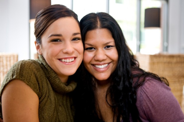 two happy healthy young women, heart disease